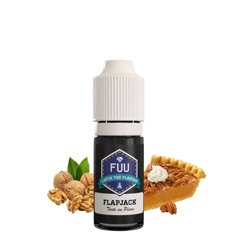 Une bouteille de e-liquide Fuu - Concentré Flapjack 10ml avec des noix à côté.