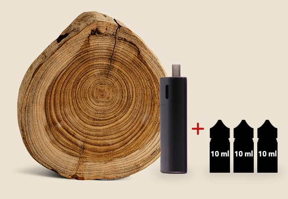 Un appareil électronique est présenté à côté d'une tranche de bois et de trois bouteilles de 10 ml.